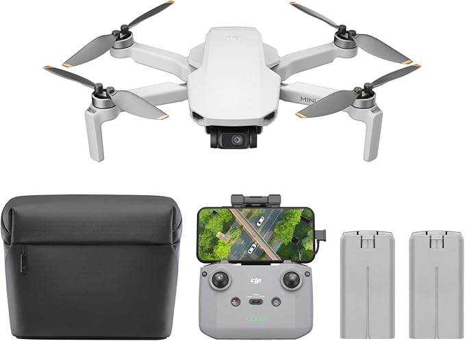 Compact drone with accessories including remote, batteries, and carry case laid out for photography enthusiasts