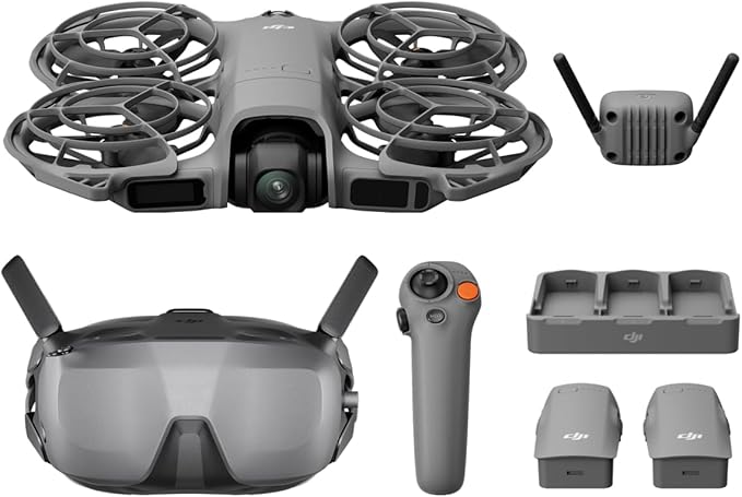 FPV drone set with goggles, remote control, charger, and batteries in grey uk design for aerial filming and racing