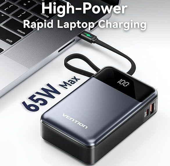 High-power 65W portable charger for rapid laptop charging with USB ports and power display connected to a laptop